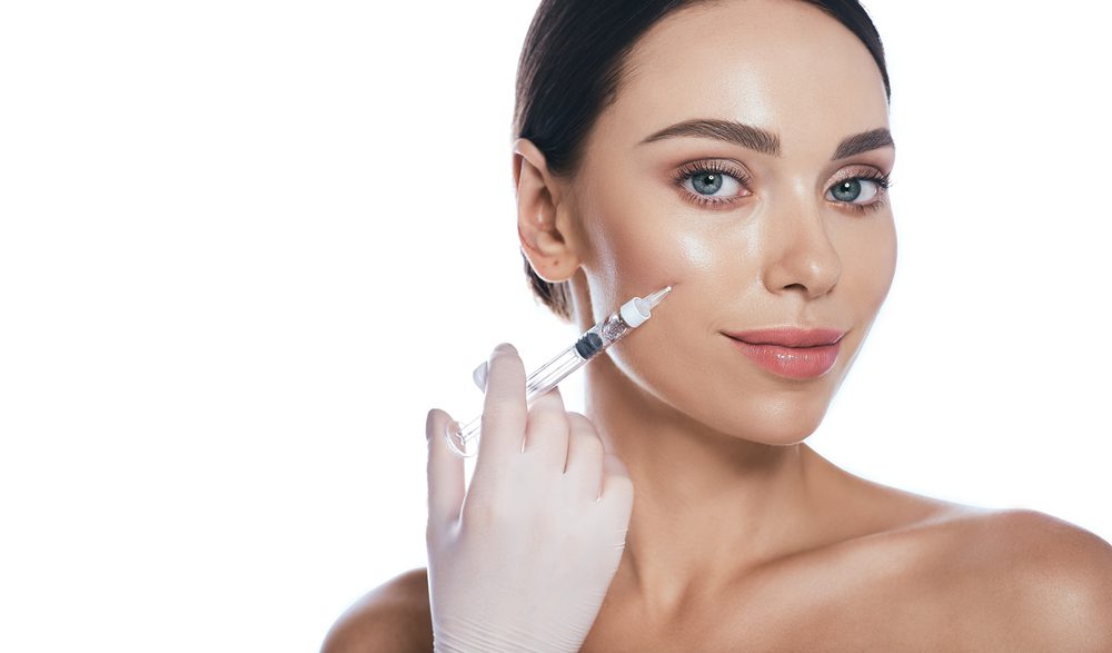 Beautician,Doing,Injections,Dermal,Fillers,Into,Female,Cheeks,For,A