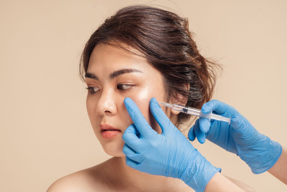 Closeup,Face,Young,Asian,Woman,Is,Getting,Filler,Under,Her Closeup,Face,Young,Asian,Woman,Is,Getting,Filler,Under,Her